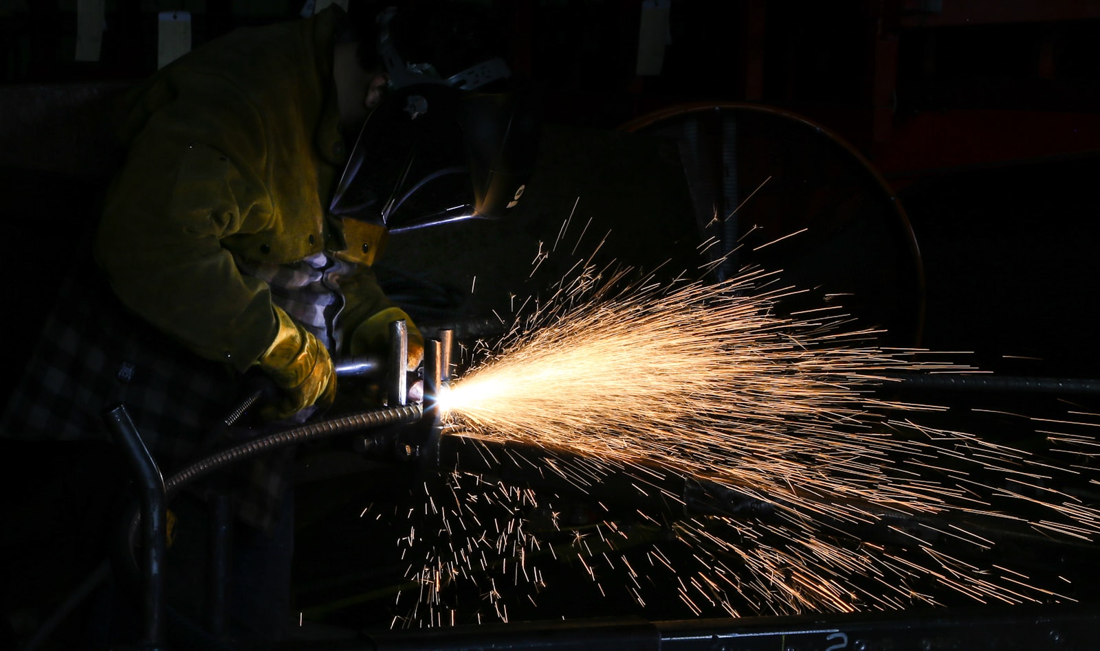 Arc welding with a shower of sparks — high heat, deep penetration
